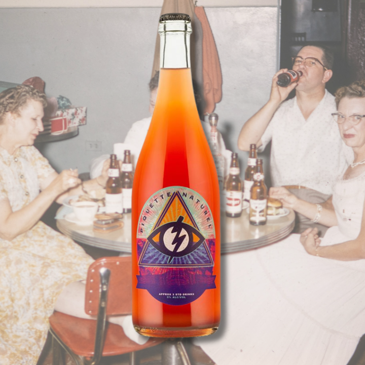 BK Wines 'Good Name #3' Piquette bottle with abstract label design, photographed against a photograph from the 80's of friends drinking beers and eating burgers.