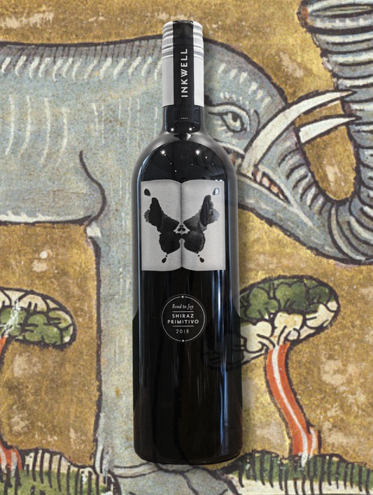 Inkwell 'Road to Joy' Shiraz Primitivo 2018 bottle with medieval elephant tapestry background